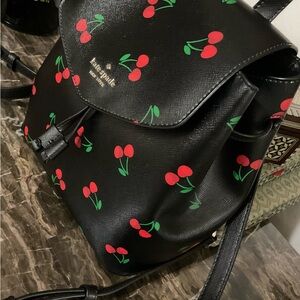 Kate Spade New York NWOT Rare Black Cherry Pattern Lizzie Med Flap Backpack Bag